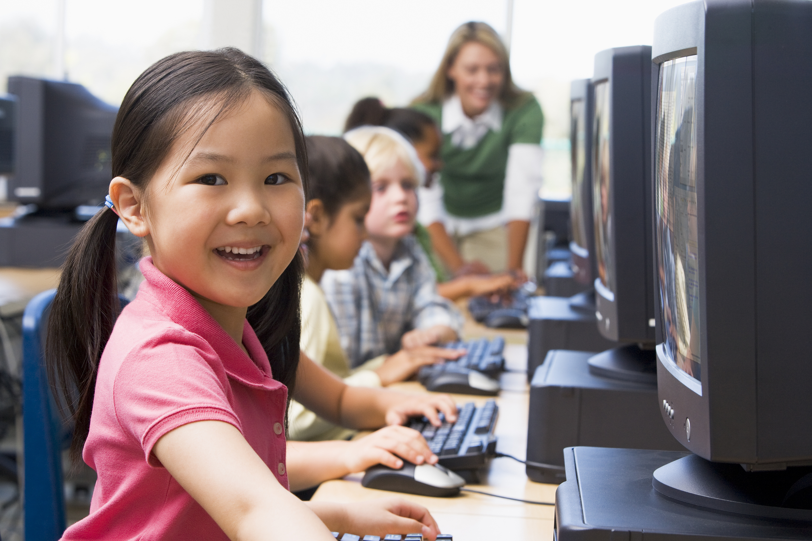 bigstock-Children-At-Computer-Terminals-3917452 | Naiku